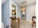 Upstairs hallway with carpet, neutral walls, and doors to bedrooms at 509 Baucom Deese Rd, Monroe, NC 28110