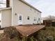 Back of house with wooden deck and landscaping at 509 Baucom Deese Rd, Monroe, NC 28110