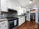 Well-appointed kitchen featuring stainless steel appliances, stylish backsplash, and plenty of counter space for meal preparation at 509 Baucom Deese Rd, Monroe, NC 28110