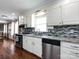 Modern kitchen with stainless steel appliances, granite countertops, and stylish backsplash at 509 Baucom Deese Rd, Monroe, NC 28110