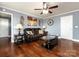 Relaxing living room with leather couch and hardwood floors at 509 Baucom Deese Rd, Monroe, NC 28110