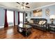 Relaxing living room with hardwood floors, comfy seating, and large windows at 509 Baucom Deese Rd, Monroe, NC 28110