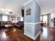 Open-concept living room with hardwood floors, blue walls and modern furniture at 509 Baucom Deese Rd, Monroe, NC 28110