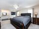 Main bedroom with plush carpet, a large bed, and ceiling fan at 509 Baucom Deese Rd, Monroe, NC 28110