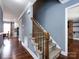 Staircase with wooden railing and carpeted steps leading to the second floor at 509 Baucom Deese Rd, Monroe, NC 28110