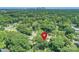 Aerial view of the home amidst lush greenery with city skyline visible in the background at 532 Scaleybark Rd, Charlotte, NC 28209