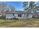 The rear of the house showcasing a deck, door and slider, providing access to the outdoors at 532 Scaleybark Rd, Charlotte, NC 28209