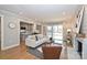 Open concept living room with kitchen, hardwood floors, and view of backyard at 532 Scaleybark Rd, Charlotte, NC 28209