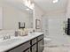 Bathroom with double vanity, tub shower combo, and modern fixtures at 5514 Galloway Dr # 63P, Stanfield, NC 28163