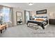 Main bedroom with a large bed and a full-length mirror at 5514 Galloway Dr # 63P, Stanfield, NC 28163