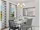 Dining room with a white table, black and white chairs, and chandelier at 5514 Galloway Dr # 63P, Stanfield, NC 28163