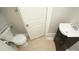 Small bathroom with pedestal sink and toilet at 700 Oak St, Charlotte, NC 28214