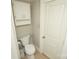 Small bathroom with toilet, wall cabinet, and shower at 700 Oak St, Charlotte, NC 28214