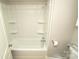 Bathroom with shower/tub combo and shelving at 700 Oak St, Charlotte, NC 28214