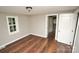 Bright bedroom with hardwood floors and white doors at 700 Oak St, Charlotte, NC 28214