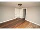 Spacious bedroom with hardwood floors and access to hallway at 700 Oak St, Charlotte, NC 28214