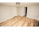 Spacious bedroom with hardwood floors and neutral-toned walls at 700 Oak St, Charlotte, NC 28214