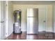 Stainless steel refrigerator and water heater in a kitchen area at 700 Oak St, Charlotte, NC 28214