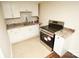 White cabinets and granite countertops in galley kitchen at 700 Oak St, Charlotte, NC 28214