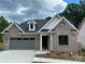 Two-story home with brick exterior, gray accents, and a two-car garage at #77 Silver Trace Ln, Denver, NC 28037