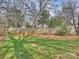 The backyard is fenced, grassy and well maintained at 833 Montford Dr, Charlotte, NC 28209