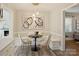 Bright breakfast nook with a built-in bench, modern lighting, and inviting decor at 833 Montford Dr, Charlotte, NC 28209