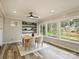 Bright dining room with built-in shelving and large windows overlooking the backyard at 833 Montford Dr, Charlotte, NC 28209