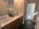 Double vanity bathroom with hexagon floor tile and a large mirror at #89 Silver Trace Ln, Denver, NC 28037