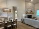 Bright dining room with hardwood floors and a view into the living room at #89 Silver Trace Ln, Denver, NC 28037