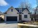 Brick home with a two-car garage and landscaped yard at #89 Silver Trace Ln, Denver, NC 28037