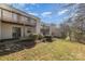 Landscaped backyard with patio and townhome view at 9153 Spyglass Pl # B, Charlotte, NC 28214