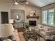 Open living space with a stone fireplace, modern furnishings, and large windows at #97 Silver Trace Ln, Denver, NC 28037