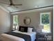 Relaxing main bedroom with tray ceiling, decorative crown moulding, and large windows at #97 Silver Trace Ln, Denver, NC 28037