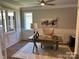 Well-lit home office with wainscoting, a ceiling fan, and a stylish wooden desk at #97 Silver Trace Ln, Denver, NC 28037