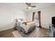 Comfortable bedroom with hardwood floors and a ceiling fan at 9706 Hamel St, Charlotte, NC 28215