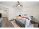 Serene bedroom with hardwood floors and ceiling fan at 9706 Hamel St, Charlotte, NC 28215