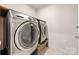 Convenient laundry room with stackable washer and dryer at 9706 Hamel St, Charlotte, NC 28215