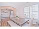 Bright dining room with hardwood floors and a modern table at 9806 Penn Station St, Cornelius, NC 28031