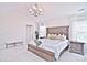 Main bedroom with king bed, tray ceiling and ensuite bath at 9806 Penn Station St, Cornelius, NC 28031