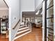 View of a light and airy foyer featuring hardwood floors, staircase, and an open layout leading to the living areas at 11107 Balata Ct, Charlotte, NC 28269