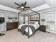 Spacious main bedroom with neutral carpet, a four poster bed, and natural lighting at 11107 Balata Ct, Charlotte, NC 28269