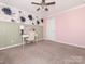 Charming bedroom with a desk and floral-patterned wallpaper at 112 Meadowcreek Village Dr, Locust, NC 28097