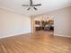 Open living room with hardwood floors and a view of the kitchen at 112 Meadowcreek Village Dr, Locust, NC 28097