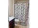 This full bath features a vanity with a sink, toilet, and a shower/tub with a shower curtain at 1148 Tangle Ridge Se Dr, Concord, NC 28025