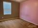 Neutral carpet, walls, and window coverings lend to this bedroom's blank canvas appeal at 1148 Tangle Ridge Se Dr, Concord, NC 28025