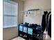 Cozy closet with storage cubes and rack providing efficient organization with natural light from window at 1148 Tangle Ridge Se Dr, Concord, NC 28025