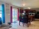 Eat-in kitchen with dark cabinets, stainless appliances, and sliding door to the backyard at 1148 Tangle Ridge Se Dr, Concord, NC 28025