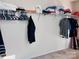 Spacious walk-in closet with upper shelving, plenty of hanging space, and carpeted floor at 1148 Tangle Ridge Se Dr, Concord, NC 28025