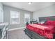 Relaxing bedroom features bright windows, neutral walls, and comfortable carpet at 14018 Promenade Dr, Huntersville, NC 28078