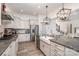 Stylish kitchen featuring granite countertops, stainless steel appliances, and a large island at 14018 Promenade Dr, Huntersville, NC 28078